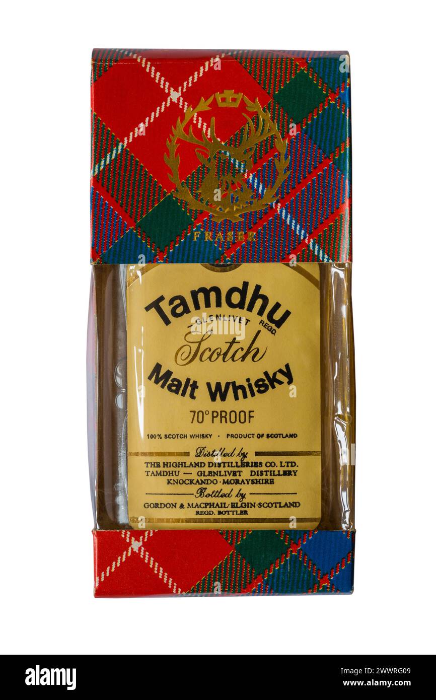 Old miniature bottle of Tamdhu Glenlivet Scotch Malt Whisky 70° proof Product of Scotland in tartan box isolated on white background Stock Photo