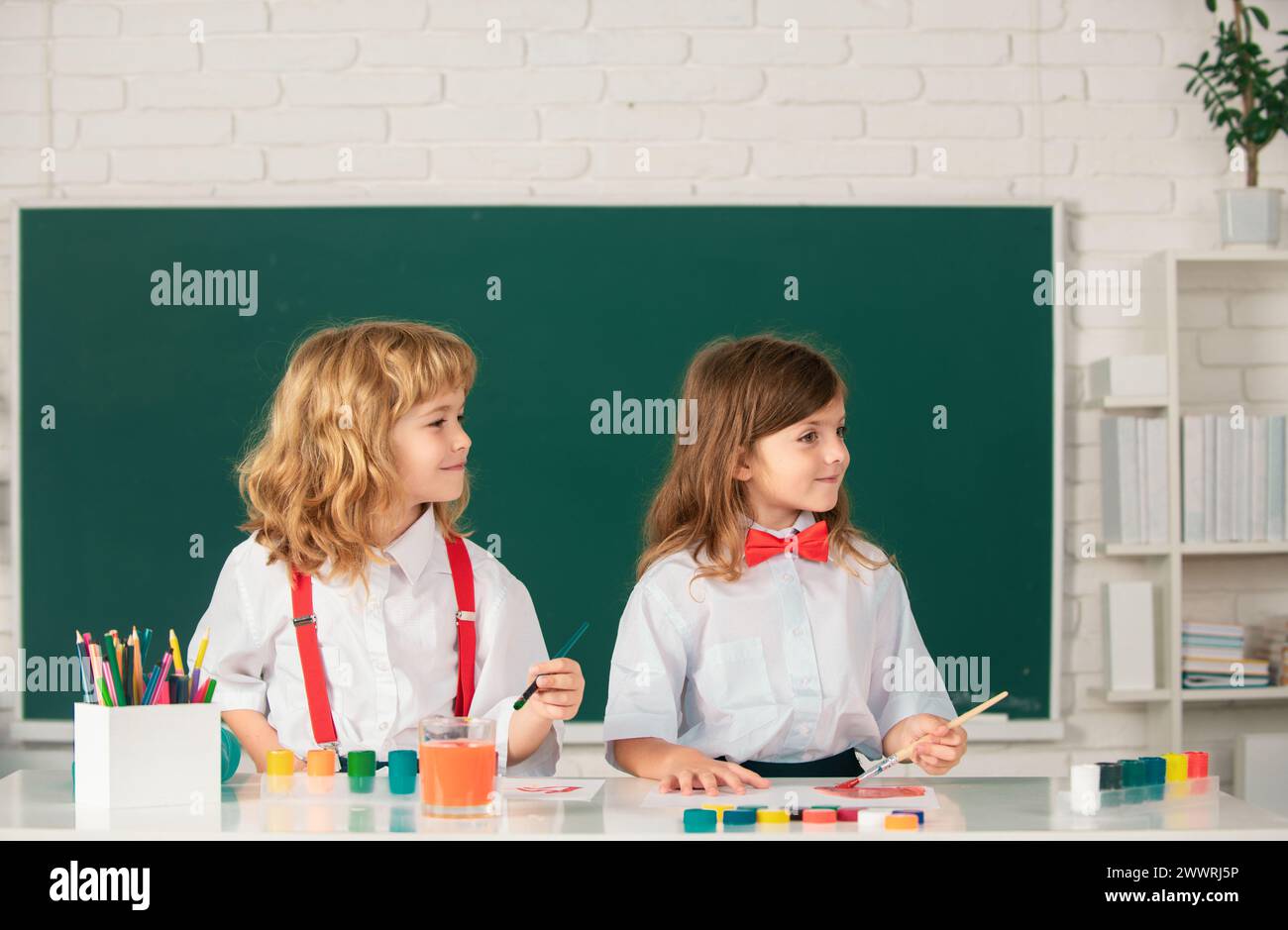 Kids creative education. School children drawing a colorful pictures ...