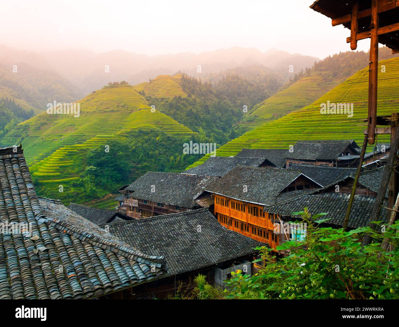 Traditional rice farming in hillside village landscape hi-res stock ...