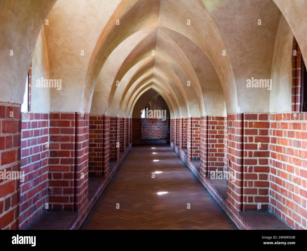 Long arched cloister in the medieval castle Stock Photo - Alamy