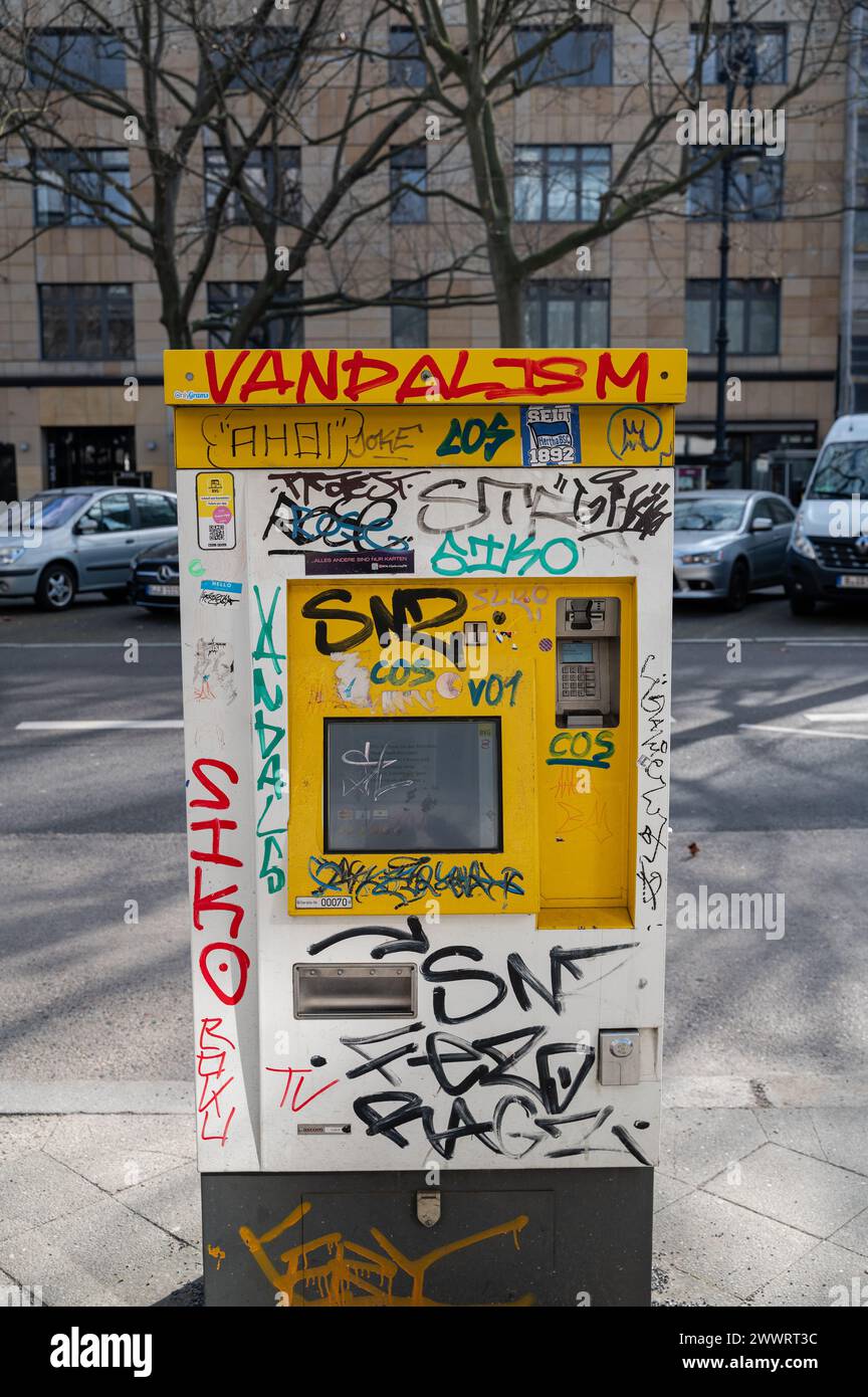 05.03.2024, Berlin, Germany, Europe - Graffiti-like scribble and vandalised surfaces on a BVG bus ticket vending machine on Kurfuerstendamm boulevard. Stock Photo