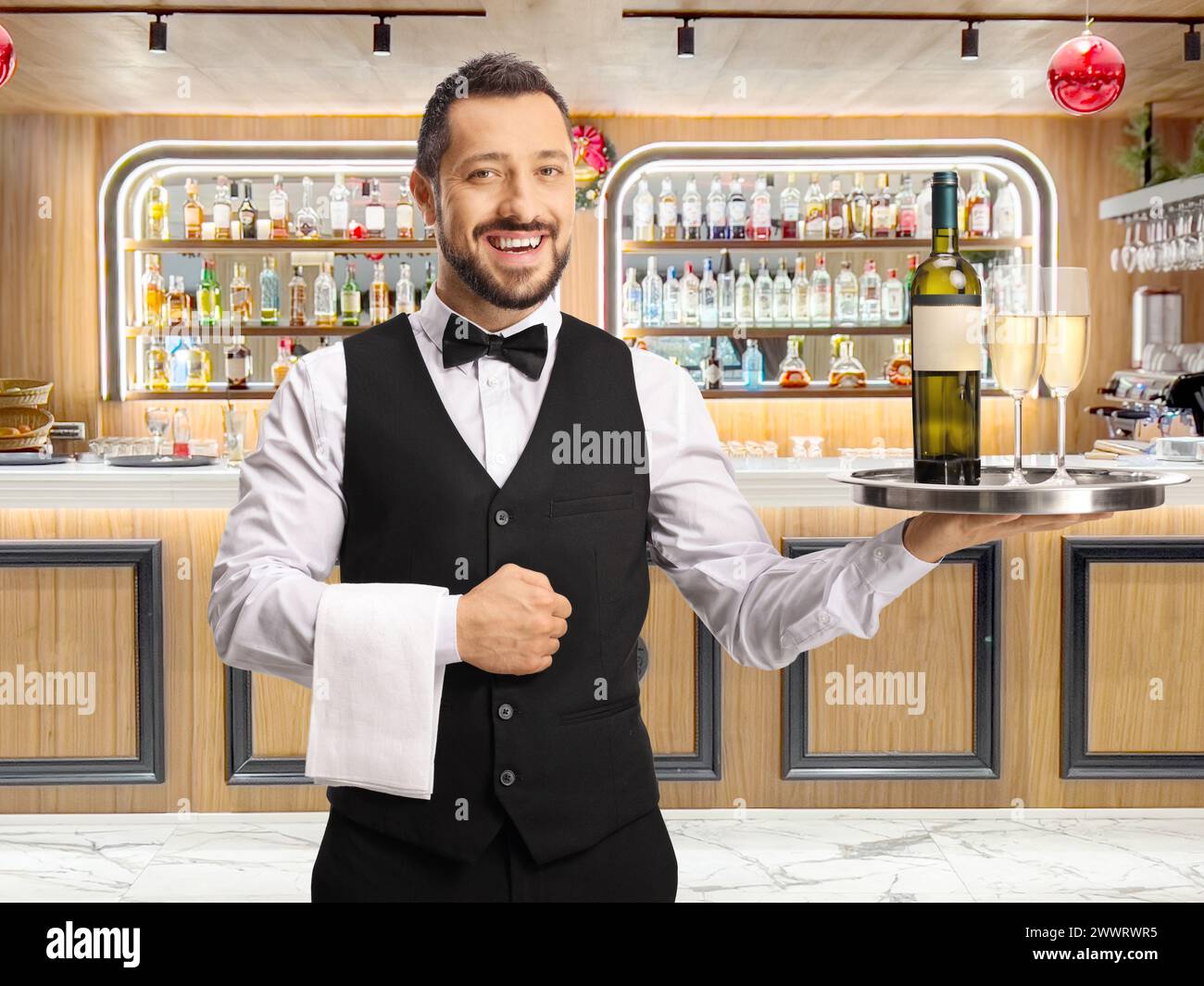 Waiter holding bottle hi-res stock photography and images - Alamy