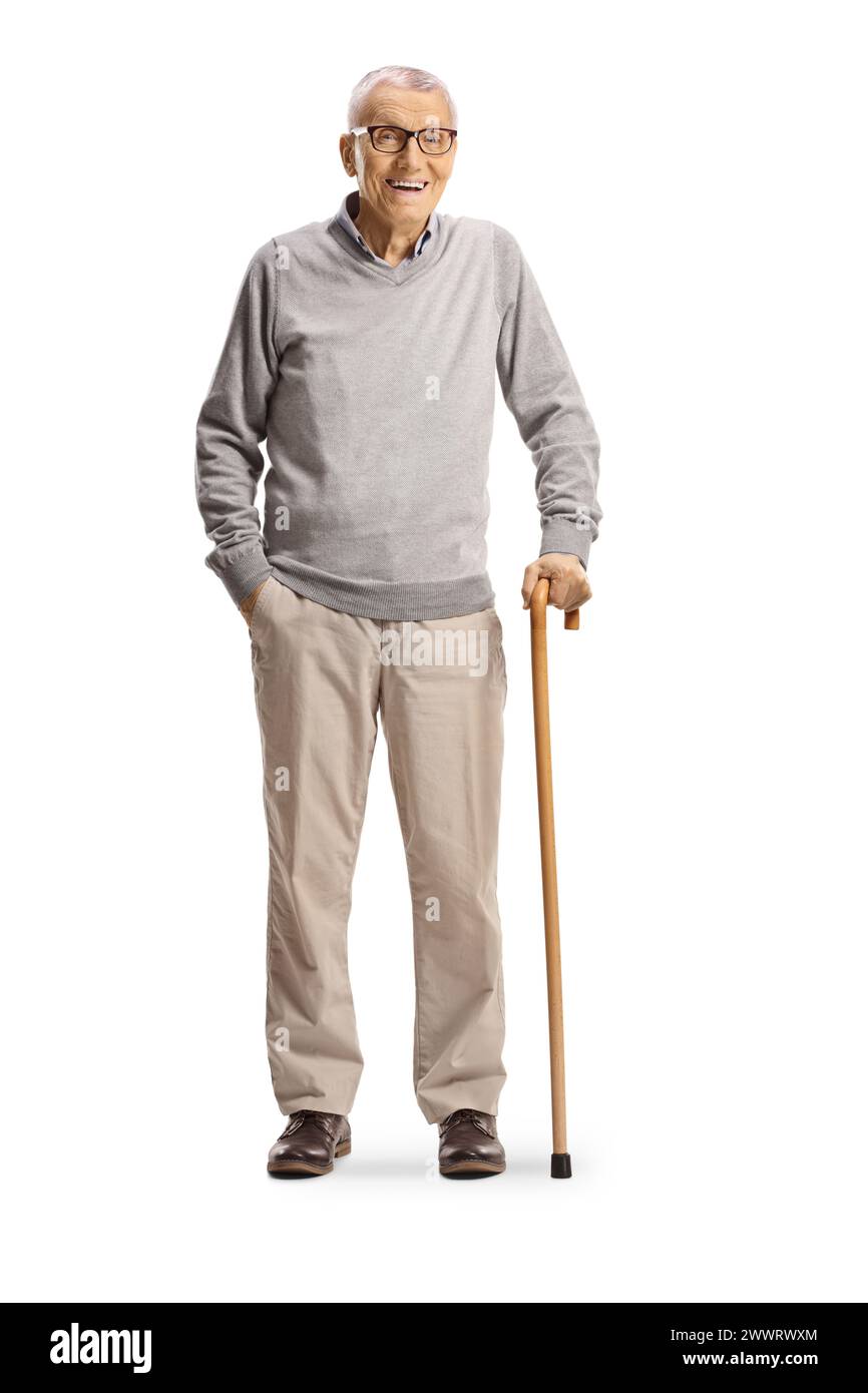 Elderly gentleman standing with a cane and smiling isolated on white ...