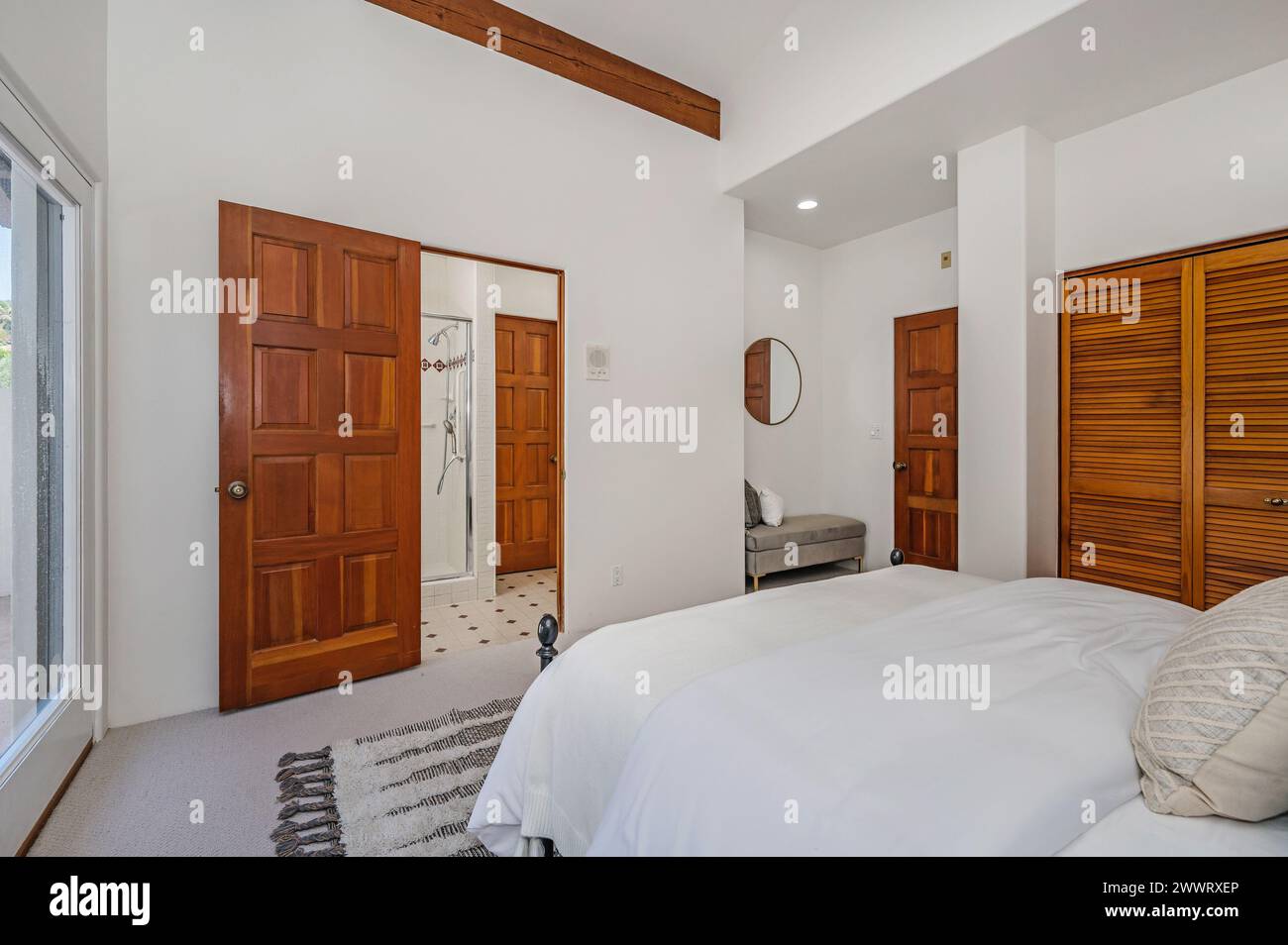 Minimalist white bedroom interior with white bed and pillows Stock ...