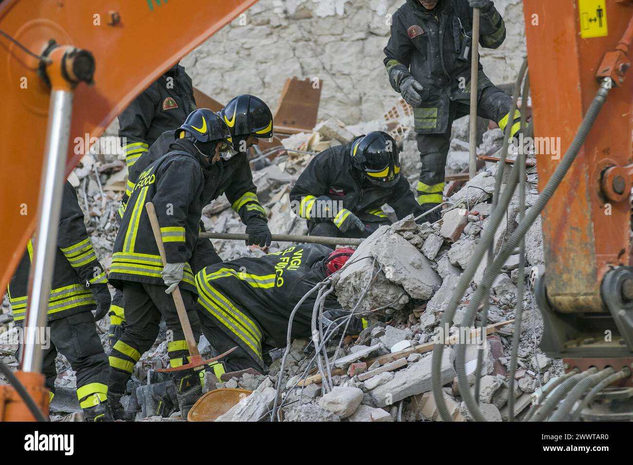 Amatrice, Rieti Italia 08 25 2016 a fireman search rescue in the ruins during the earthquake in central Italy. Stock Photo