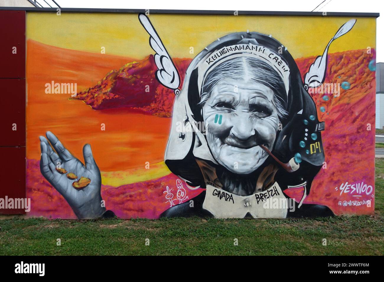 old Gaul with winged helmet greets from a graffiti wall, France, Brittany Stock Photo