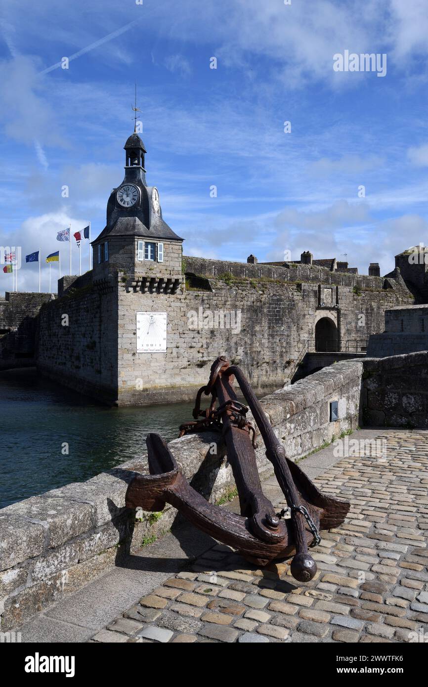 southwest corner of the wall of Ville Close with clock and sundial, France, Brittany, Concarneau Stock Photo