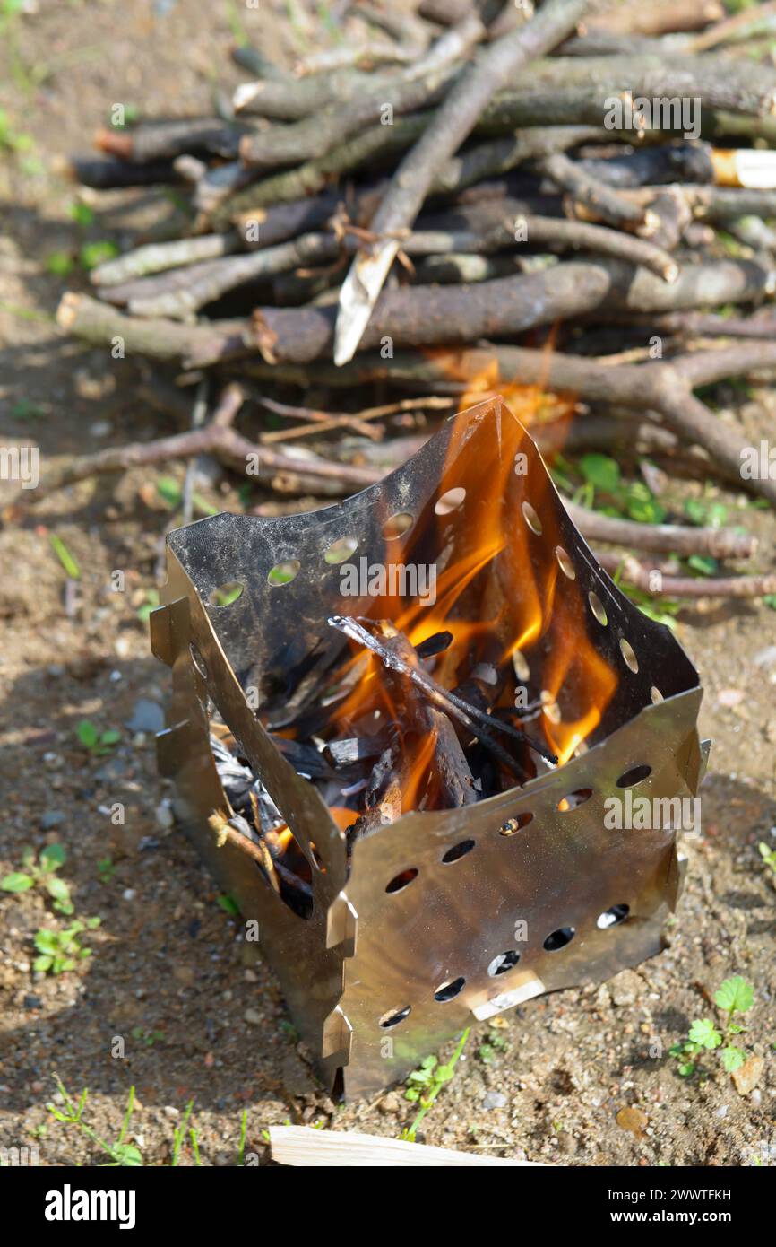 fire is lit in a hobo cooker Stock Photo