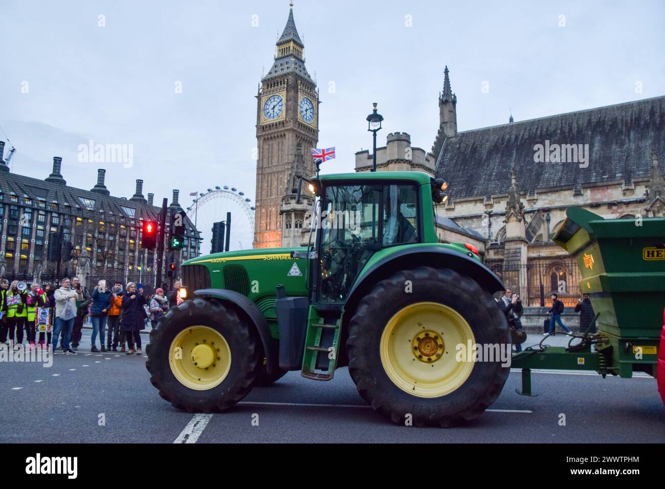 London, UK. 25th Mar, 2024. British farmers in tractors stage a protest ...