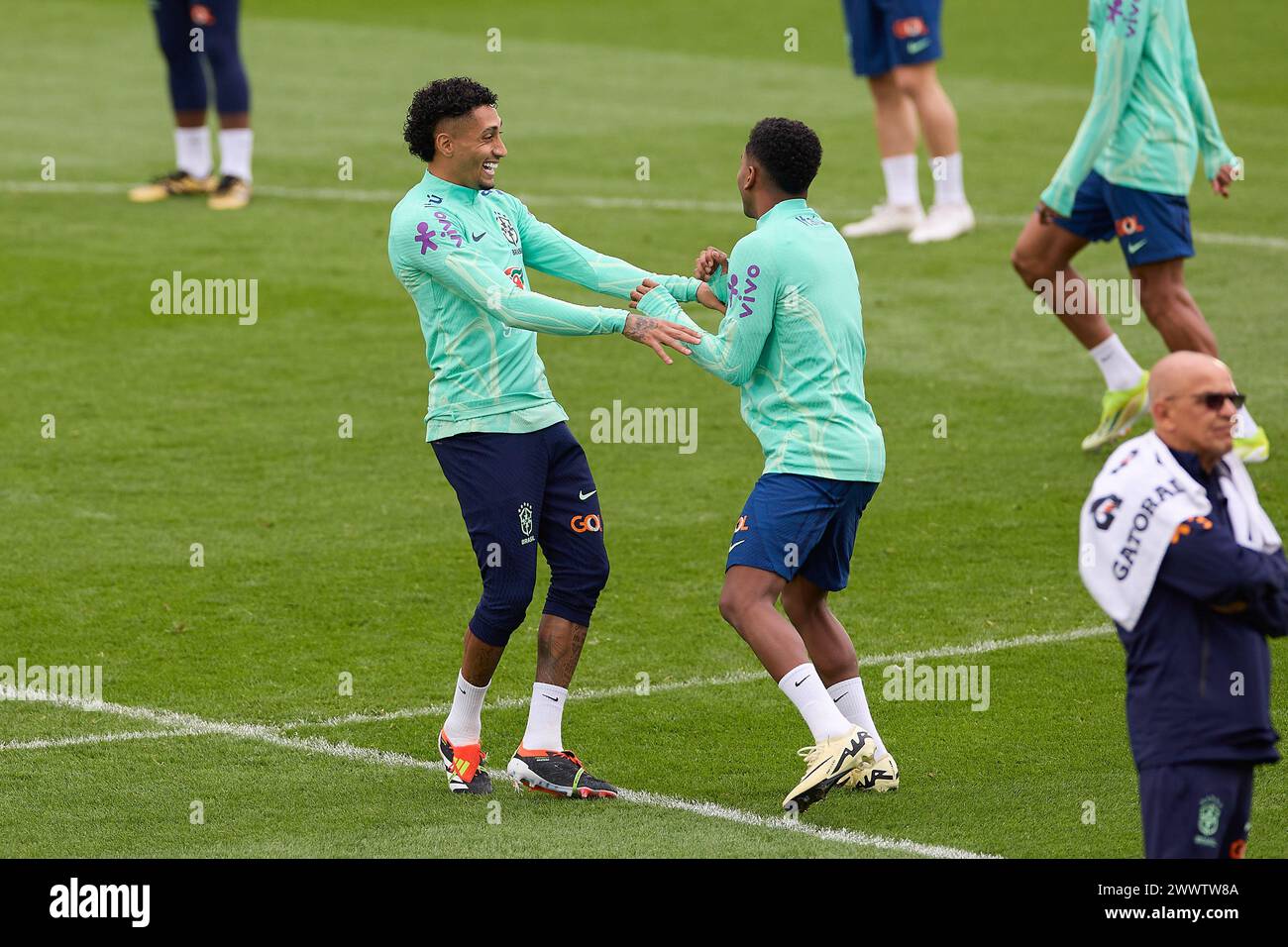 Madrid, Spain. 25th Mar, 2024. Raphael Dias Belloli, known as Raphinha (L) of Brazil jokes with Rodrygo Goes (R) of Brazil during the Brazilian National Football Team training on the eve of the international friendly match between Spain and Brazil at Alfredo Di Stefano Stadium. Credit: SOPA Images Limited/Alamy Live News Stock Photo