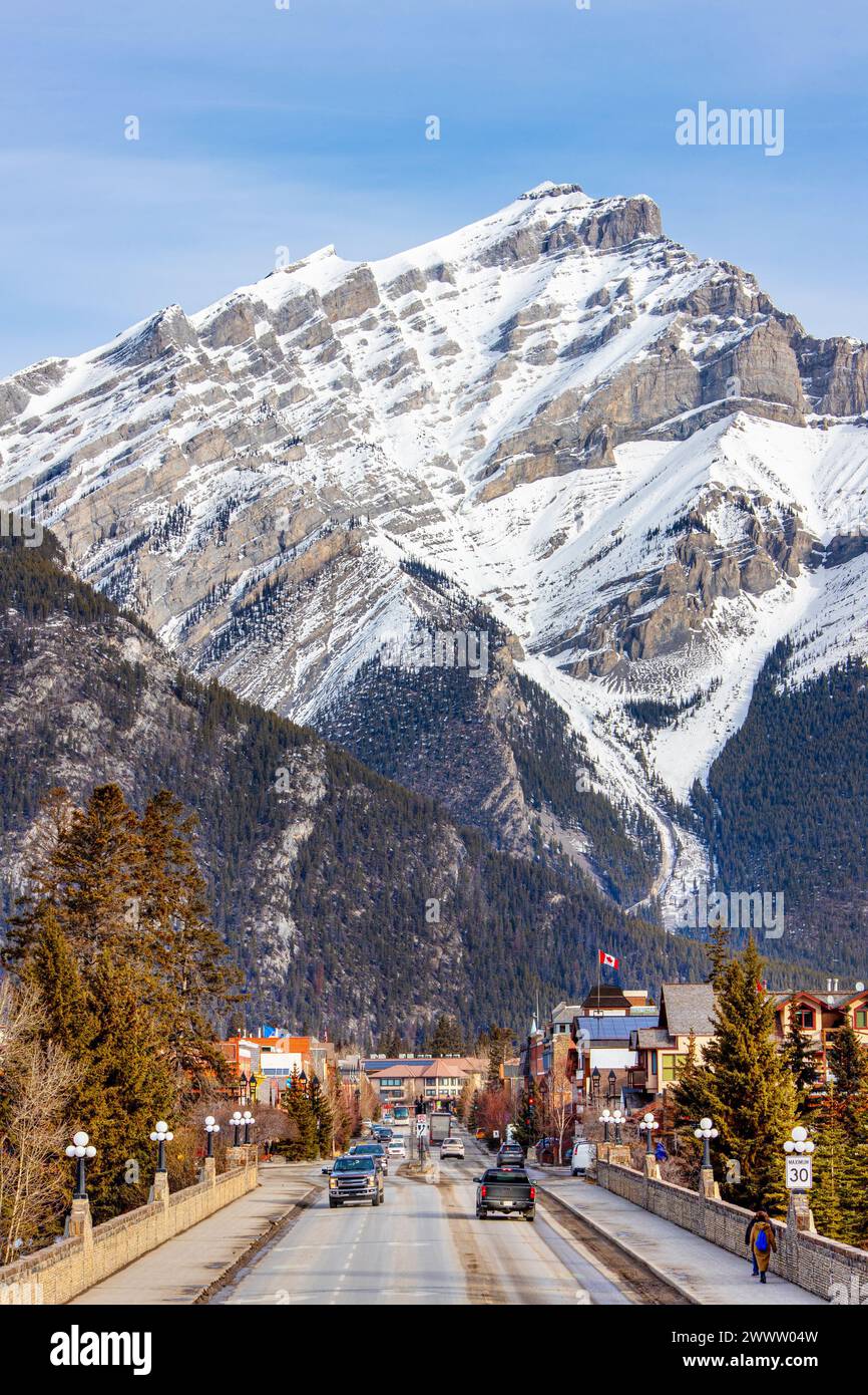 Majestic Cascade Mountain looms over Banff Avenue in Banff National Park. The townsite is a major Canadian tourist destination renowned for its mounta Stock Photo