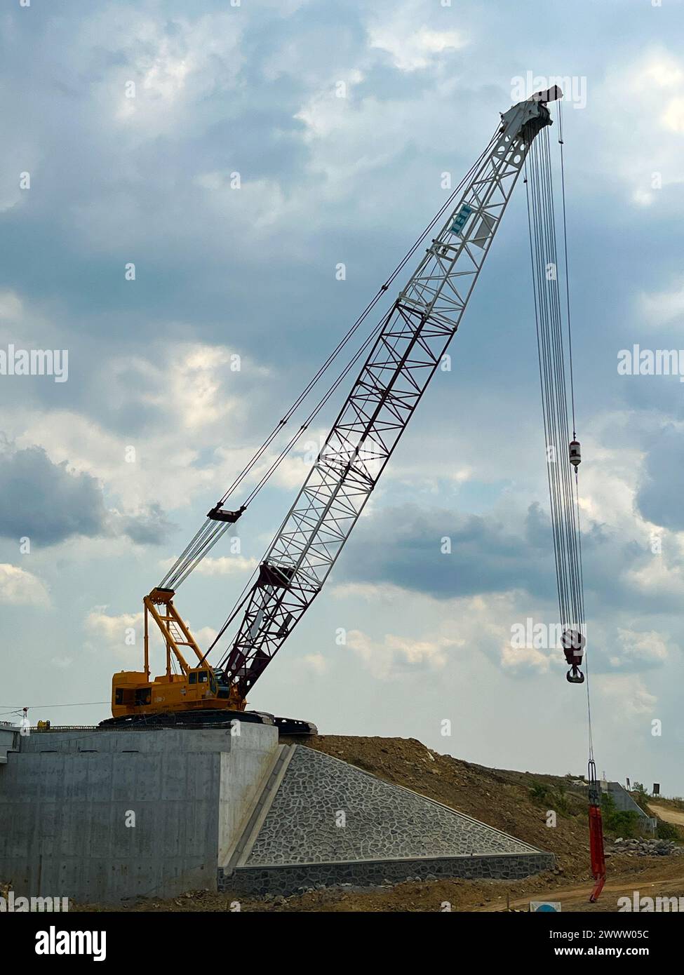 big Mobile cranes are lifting bridge trusses for transportation to be