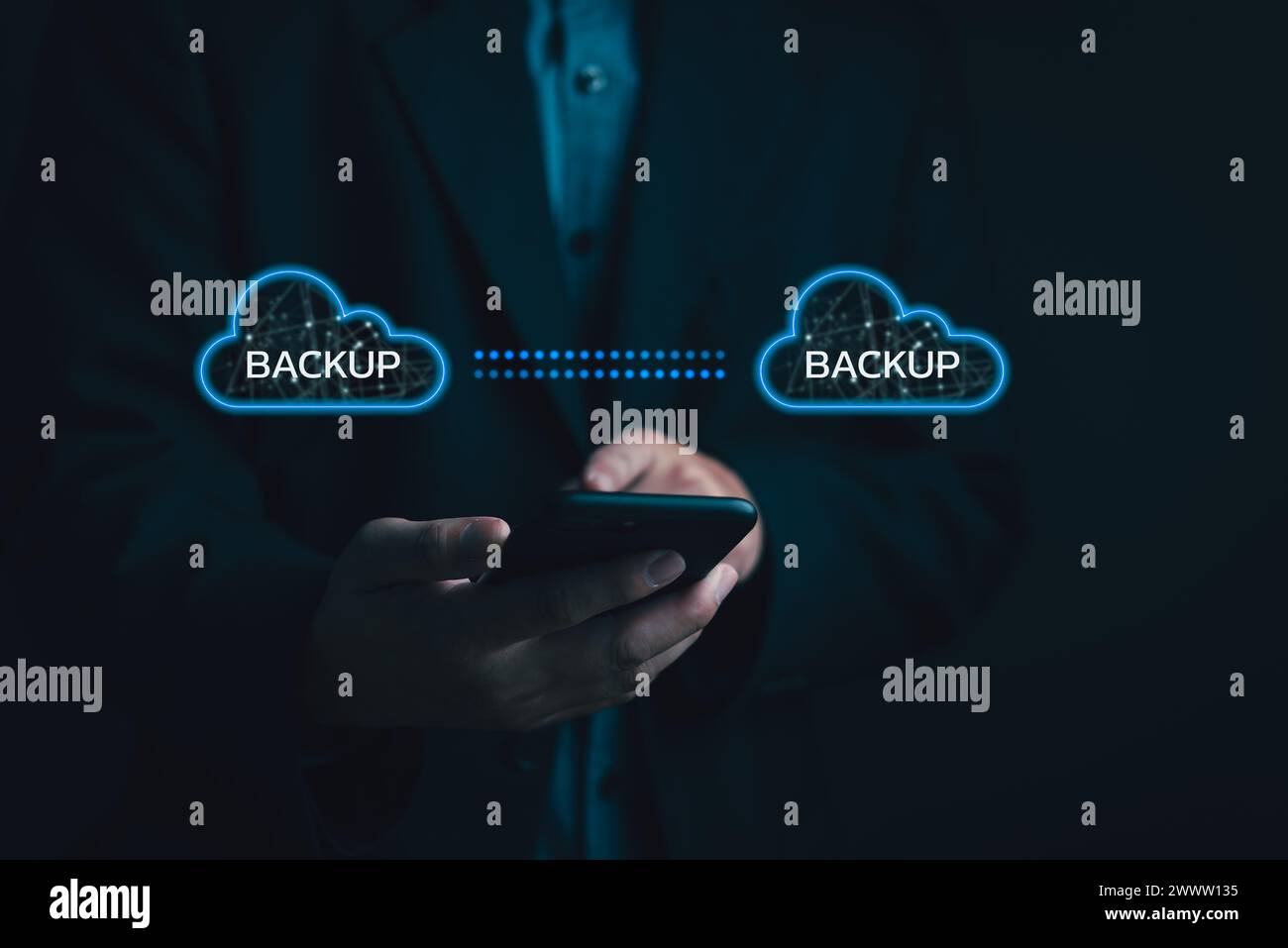 Businessman Interacting with a Backup Interface virtual cloud network data security system internet online with futuristic holographic digital technol Stock Photo