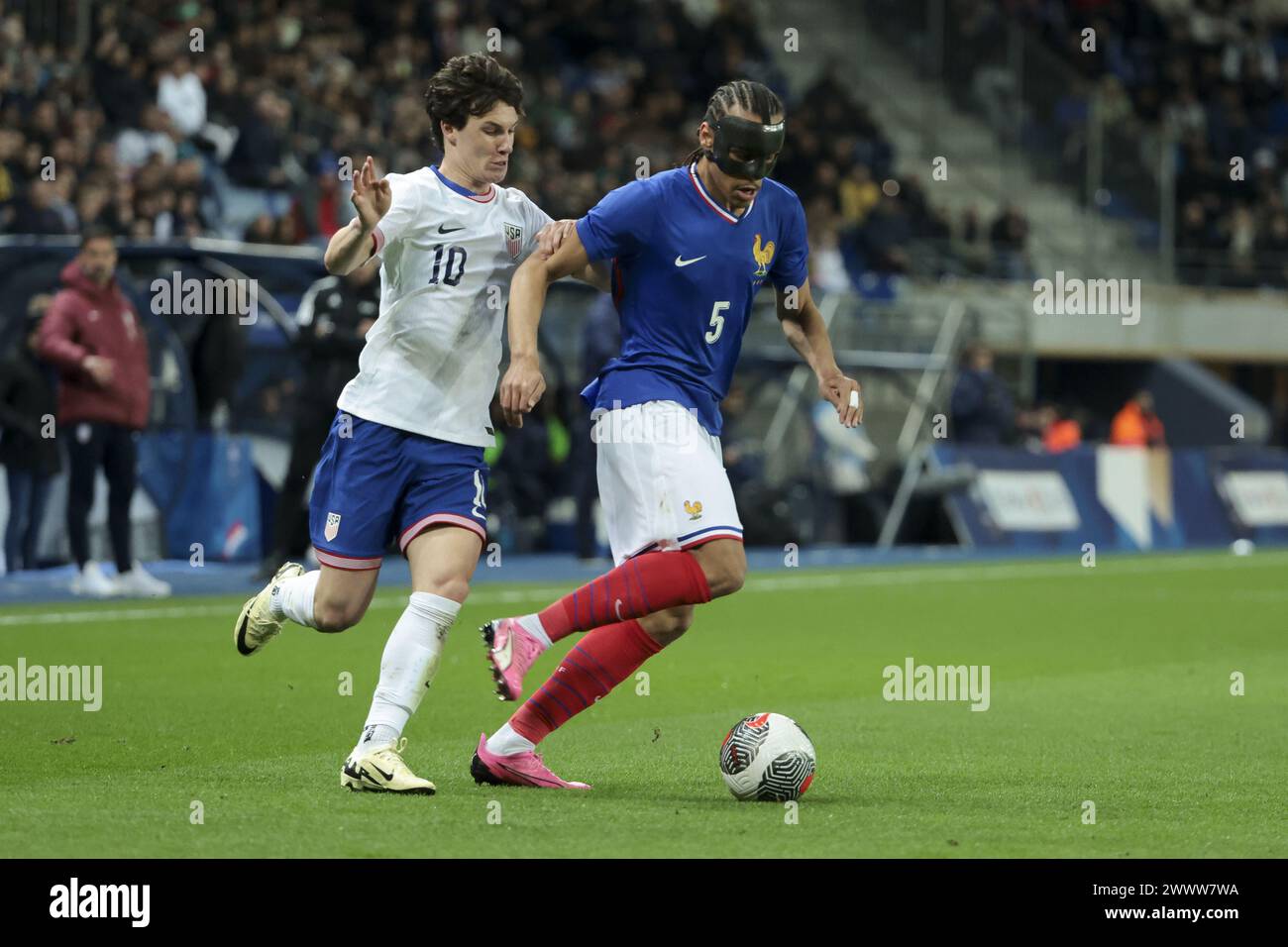 Kiliann Sildillia of France, left Paxten Aaronson of USA during the International Under 23 Friendly football match between France U23 and United States, USA U23 on March 25, 2024 at Stade Auguste Bonal in Sochaux Montbeliard, France Stock Photo