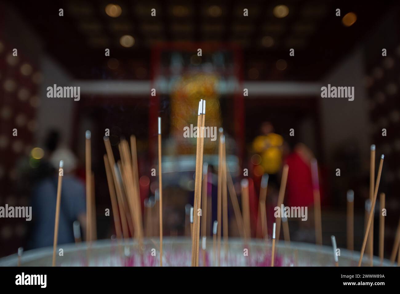 Close up of burning incense sticks at the Buddha Tooth Relic Temple, Chinatown, Singapore. 2024