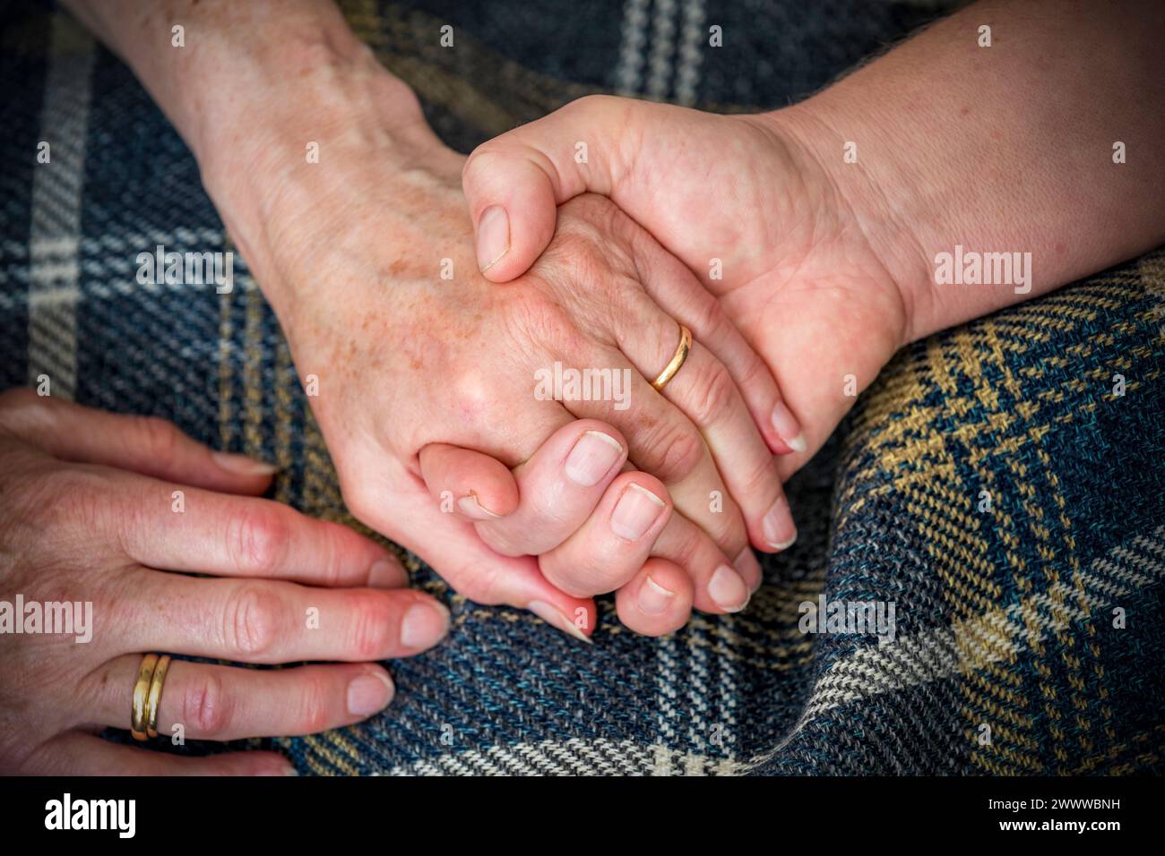 Two Holding Hands; Caring; UK Stock Photo