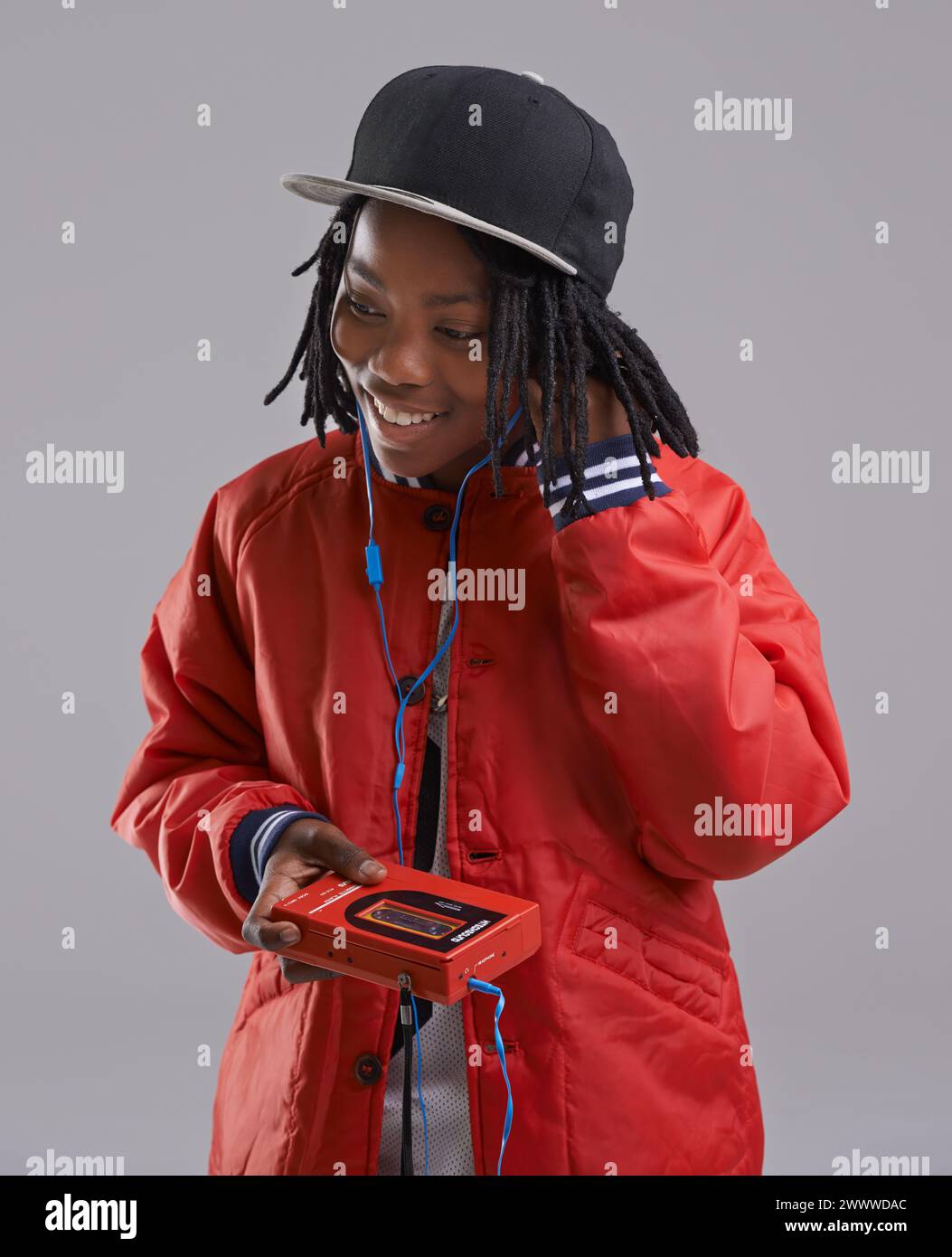 Music, happy and child on gray background with cassette for listening