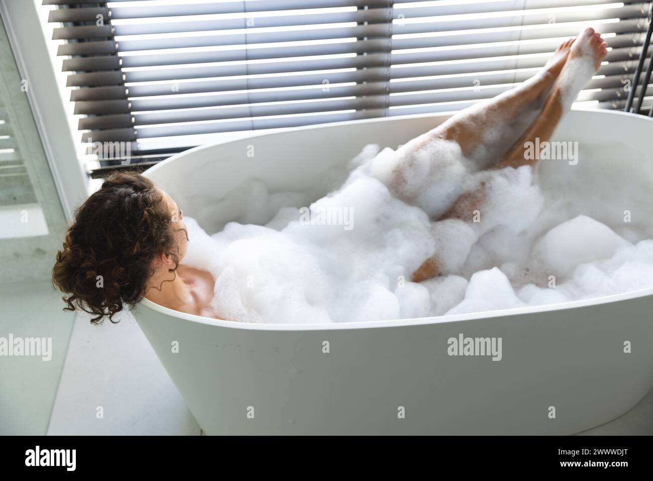 Woman in bath legs hi-res stock photography and images - Alamy