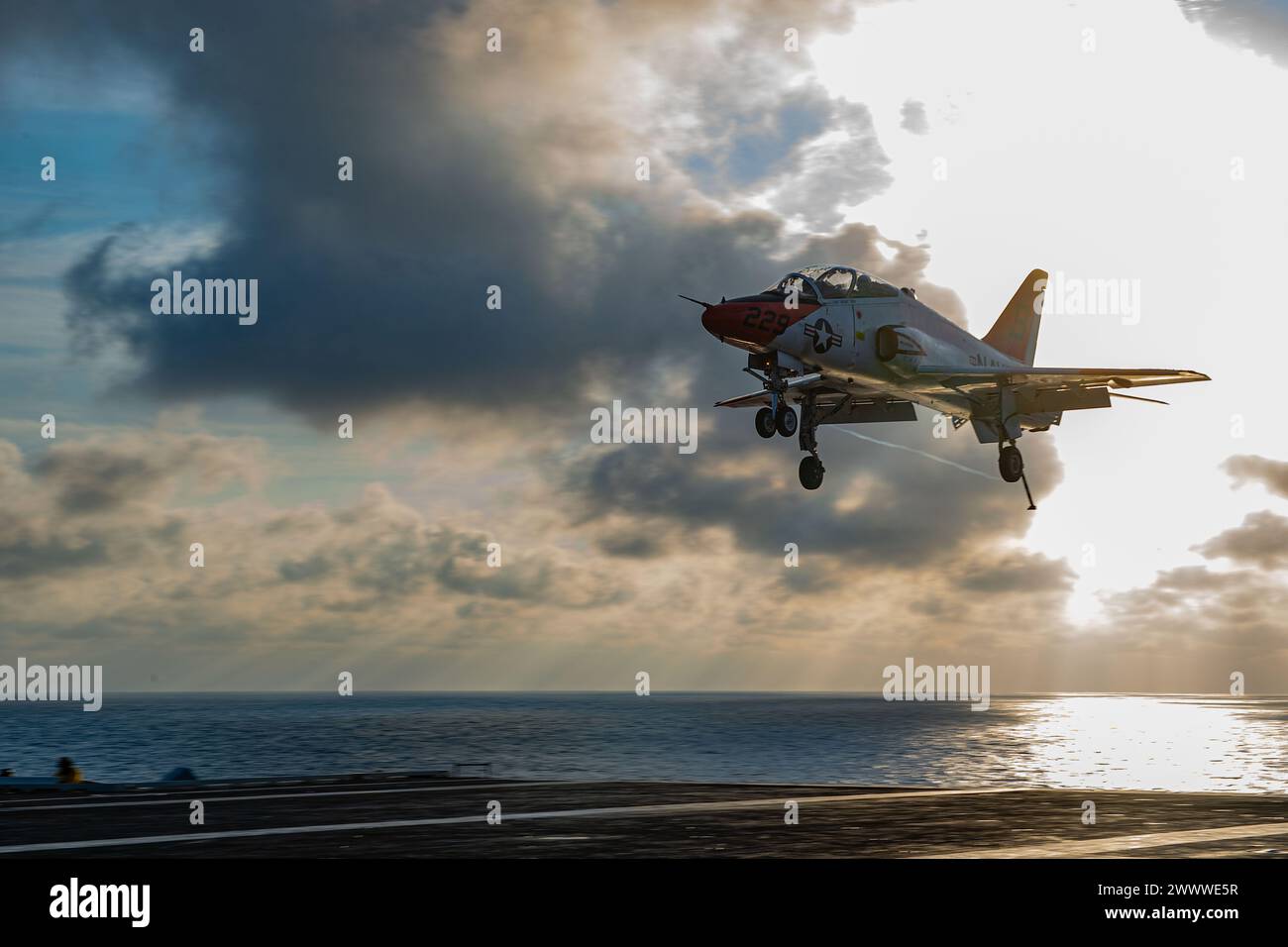 240317-N-FY193-1058 ATLANTIC OCEAN (Mar. 17, 2024) A T-45 Goshawk, attached to the “Eagles” of Strike Jet Training Squadron (VT) 7, prepares to land Stock Photo