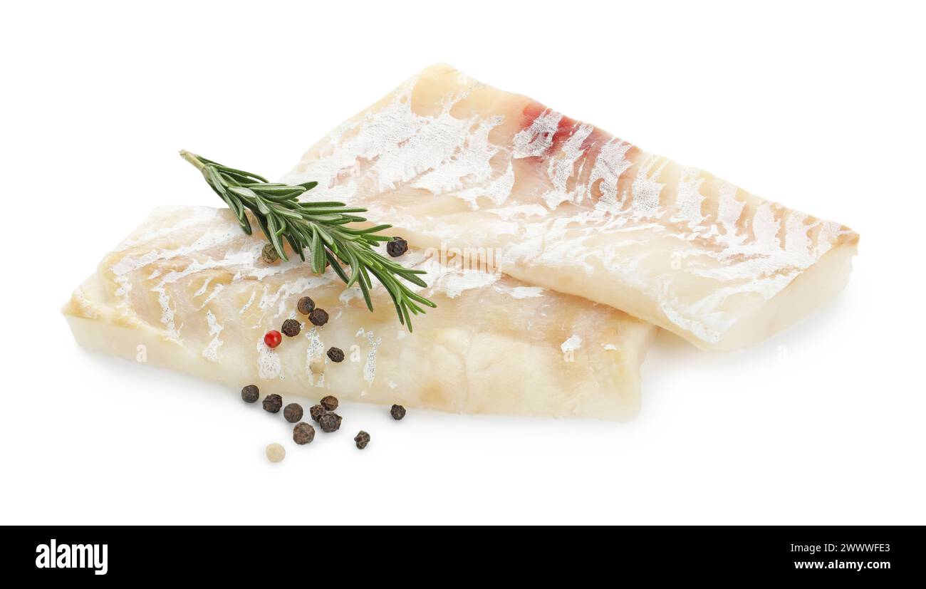 Fresh raw cod fillets with rosemary and peppercorns isolated on white ...