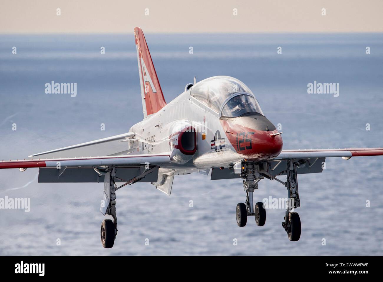 240319-N-TY639-1255 ATLANTIC OCEAN (Mar. 19, 2024) A T-45 Goshawk, attached to the “Eagles” of Strike Jet Training Squadron (VT) 7, approaches Stock Photo