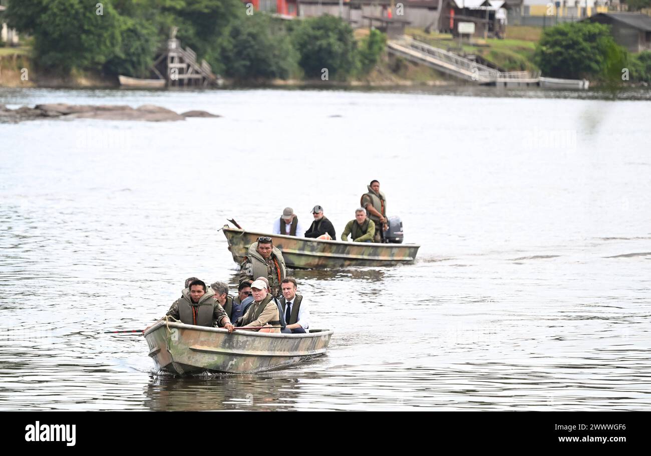 Camopi, French Guiana. 25th Mar, 2024. French President Emmanuel Macron and his delegation arrive to the village of Camopi on a boat of the 3rd regiment of the French foreign legion cruise on the Oyapock river to visit forest with his delegation and locals in Camopi on March 25, 2024, as part of Macron's two-day visit to the French overseas department of Guiana. Photo by Jacques Witt/Pool/ABACAPRESS.COM Credit: Abaca Press/Alamy Live News Stock Photo