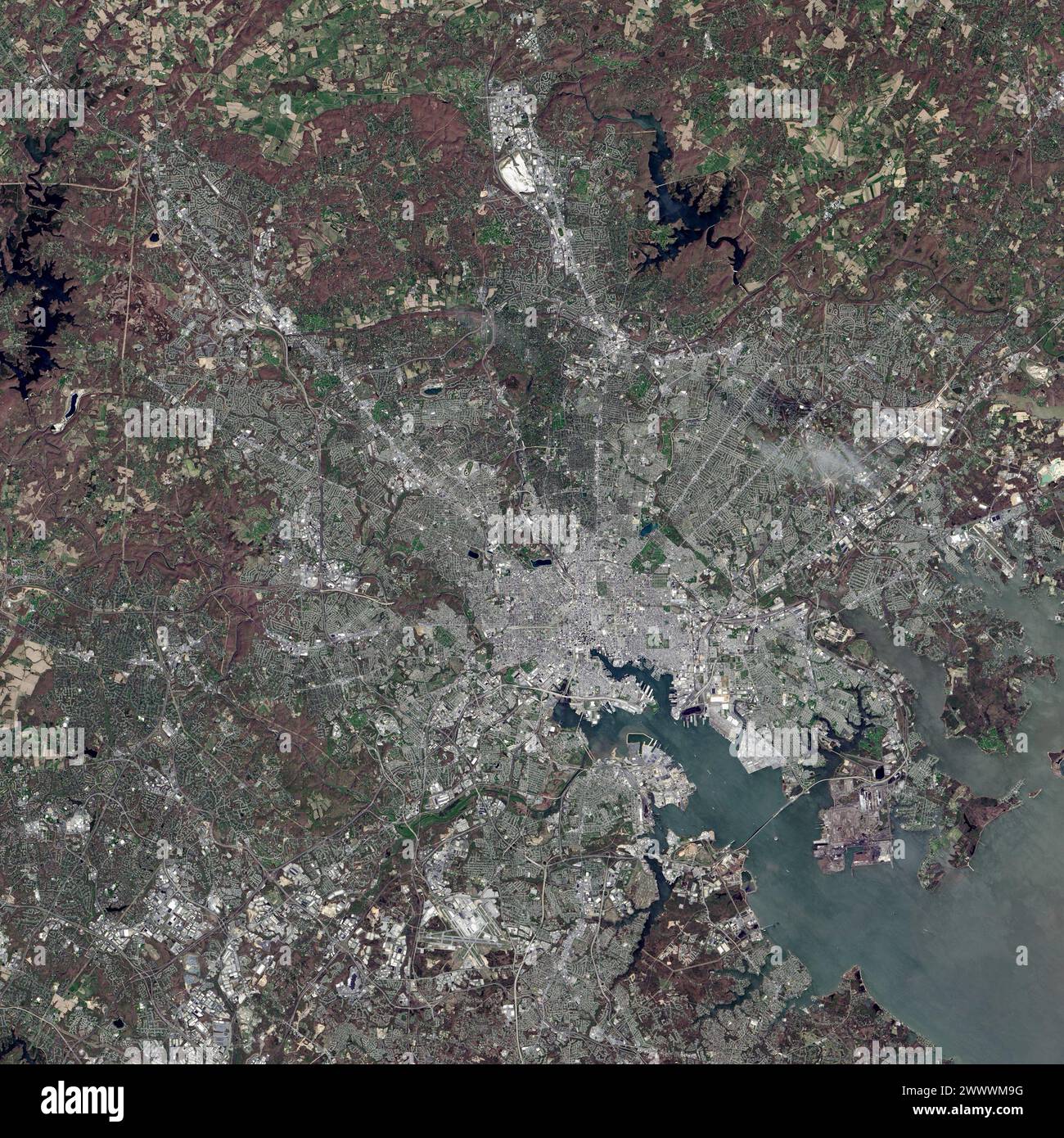 On 24 April 2014, the Operational Land Imager on Landsat 8 captured this view of Baltimore, and its harbour. The Francis Scott Key Bridge can be seen in the bottom right spanning the harbour entrance. Francis Scott Key Bridge, Baltimore. On 26 March 2024 c.1:27 EDT, the entirety of the through truss bridge collapsed after the Singaporean container ship Dali collided with a support pillar. An unknown number of vehicles and construction workers were on the bridge at the time of the collision and subsequent collapse.  Credit: NASA / USGS / Alamy Live News via Digitaleye Stock Photo