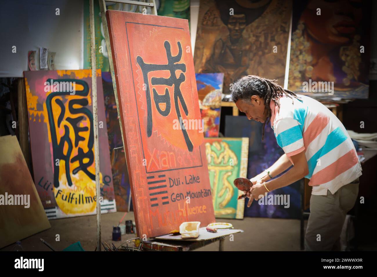 Addis Ababa, Ethiopia. 18th Mar, 2024. Artist Dawit Muluneh works on