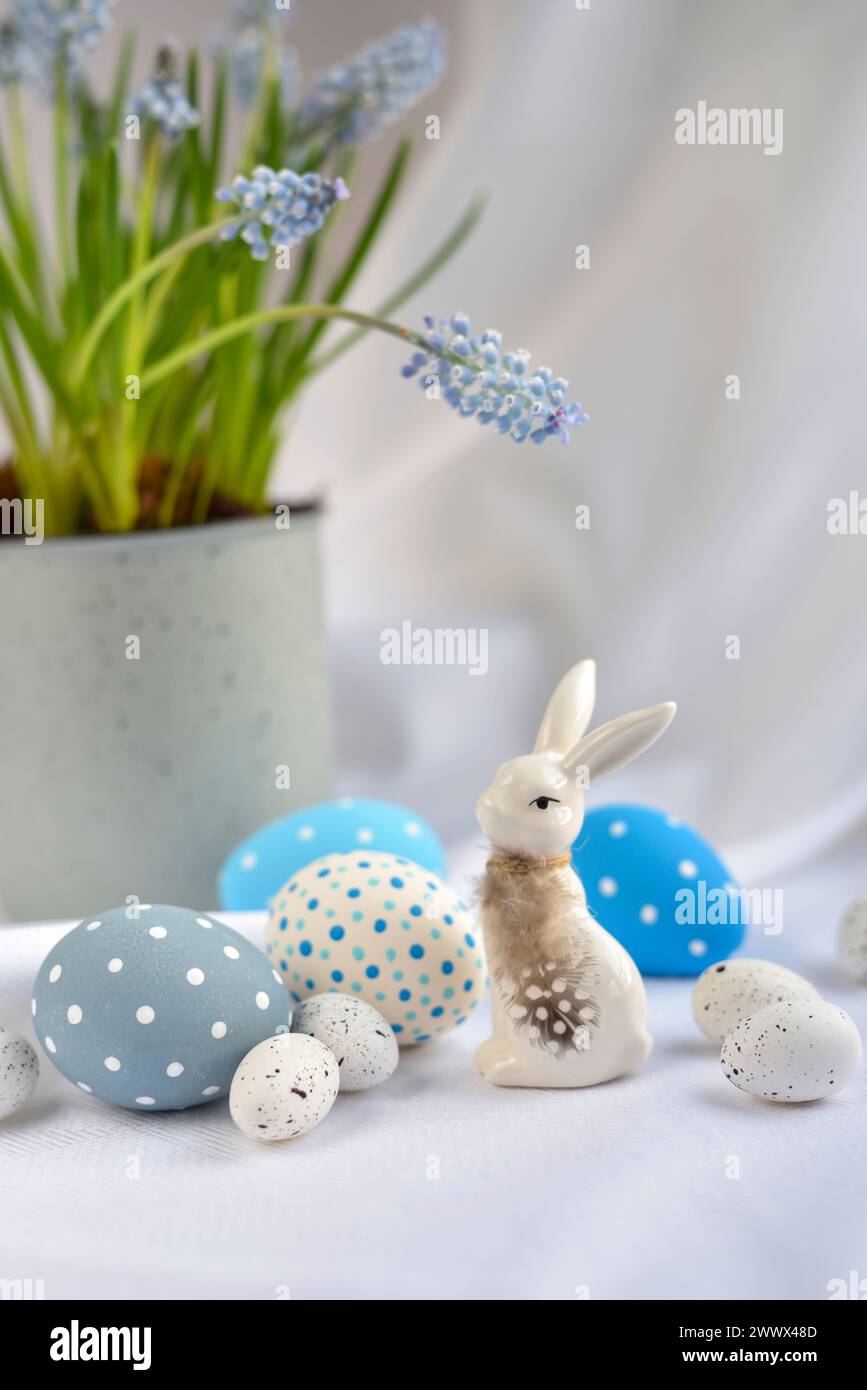 Easter composition with white rabbit, eggs and spring flowers. Easter still life Stock Photo