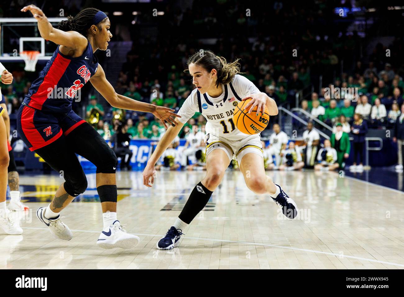 South Bend, Indiana, USA. 25th Mar, 2024. Notre Dame guard Sonia Citron (11) drives to the baseline as Mississippi forward Tyia Singleton (22) defends during NCAA Women's Tournament Second Round basketball game action between the Mississippi Rebels and the Notre Dame Fighting Irish at Purcell Pavilion at the Joyce Center in South Bend, Indiana. John Mersits/CSM (Credit Image: © John Mersits/Cal Sport Media). Credit: csm/Alamy Live News Stock Photo