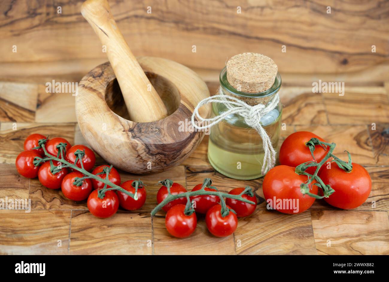 fresh tomato vinegar on olive wood Stock Photo