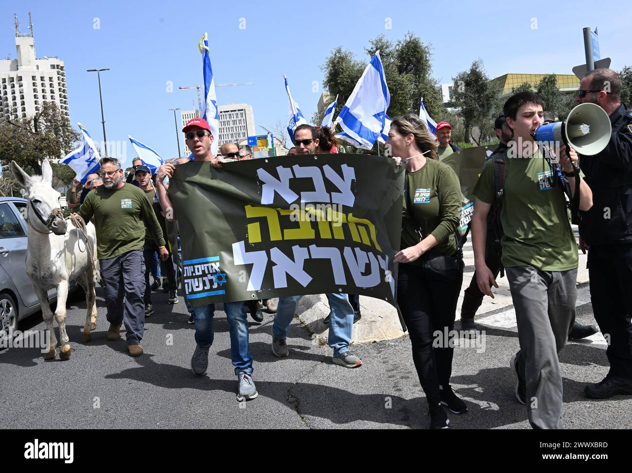 Jerusalem, Israel. 26th Mar, 2024. Israeli army reserve activists from Brother In Arms walk with a donkey at a protest against military exemption for the Ultra-Orthodox, Haredim, outside Prime Minister Benjamin Netanyahu's office in Jerusalem on Tuesday, March 26, 2024. Protesters demand equality in Israeli military service with the slogan 'We will not continue to be your donkey' referring to mandatory military service for all Israelis except for the Ultra-Orthodox religious Jews. Photo by Debbie Hill/ Credit: UPI/Alamy Live News Stock Photo