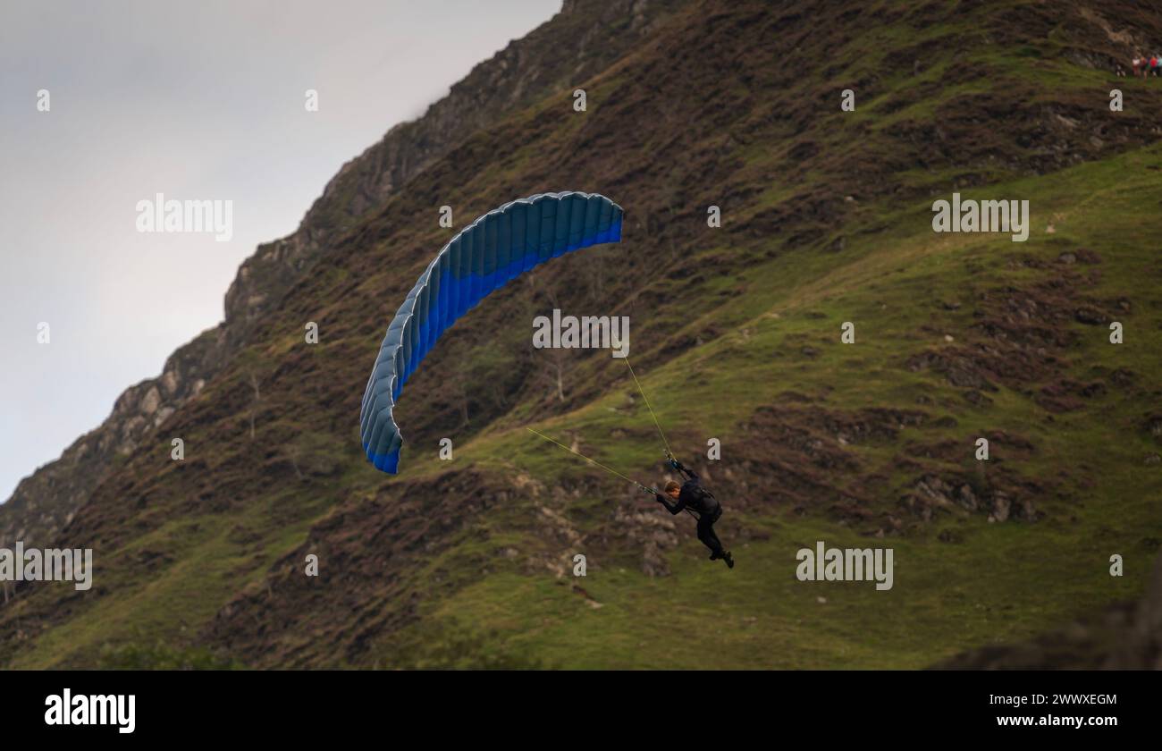 Filming of Mission Impossible Dead Reckoning Part 1. Tom Cruise Speed flying in the Lake District hills around Buttermere, Cumbria, UK. Stock Photo