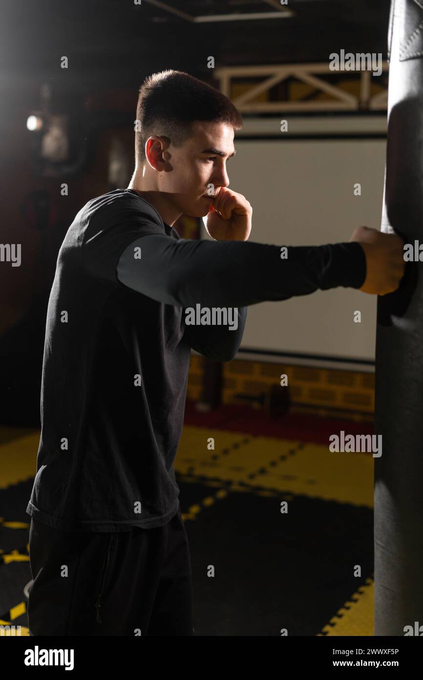 Aggressive kickboxer hitting punching bag hi-res stock photography and ...