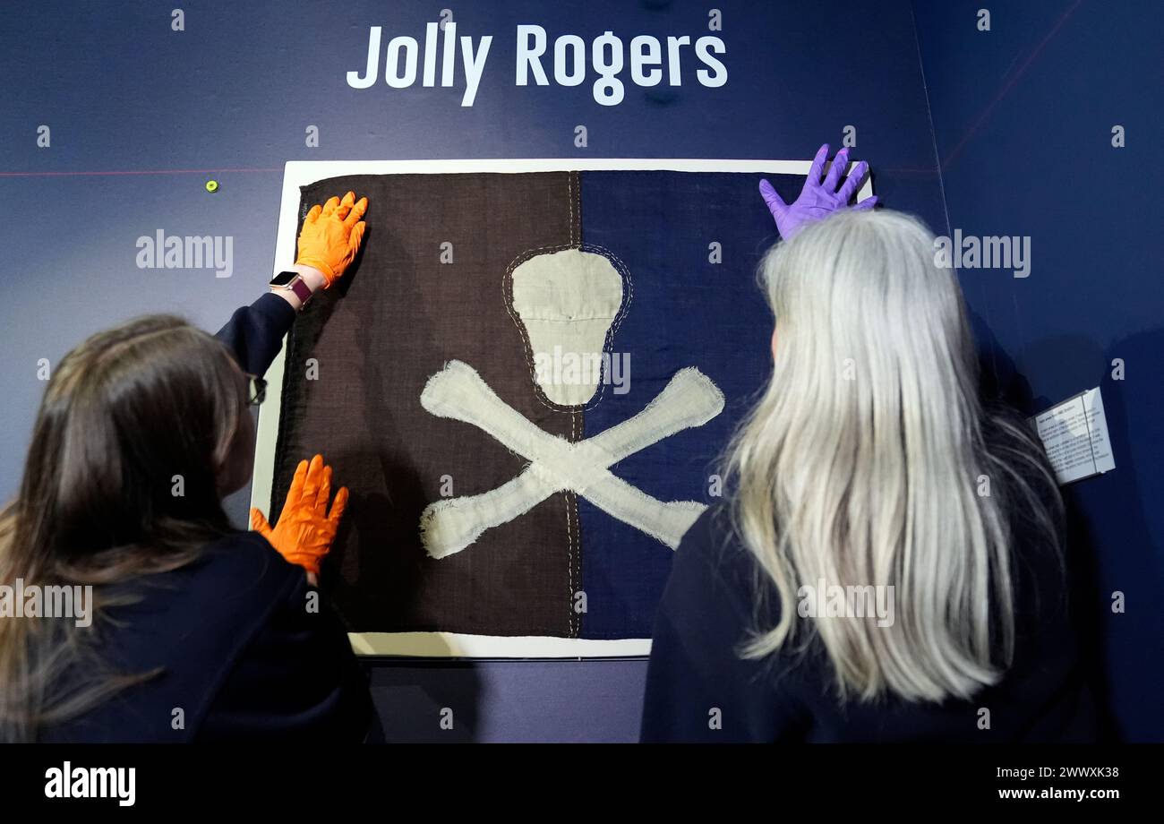 The earliest known surviving example of a Royal Navy submarine Jolly Roger, flown from HMS E54 during the First World War, is installed as part of a Jolly Roger display at the Royal Navy Submarine Museum in Gosport, Hampshire. Picture date: Tuesday March 26, 2024. Stock Photo