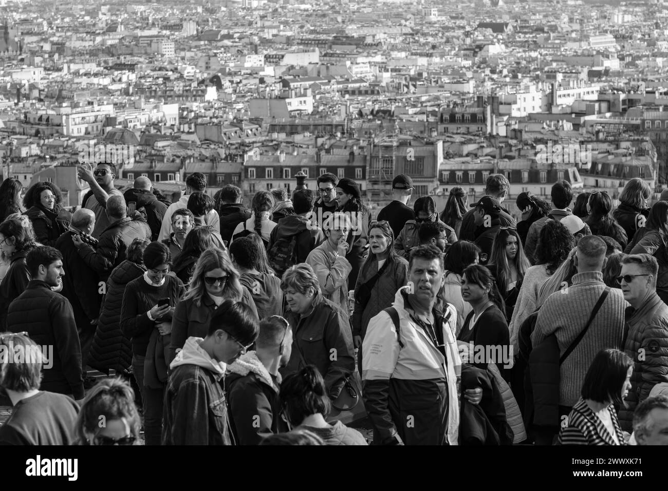 Paris, France - February 17, 2024 : View of crowds of tourists in Montmartre enjoying the panoramic view of Paris France Stock Photo
