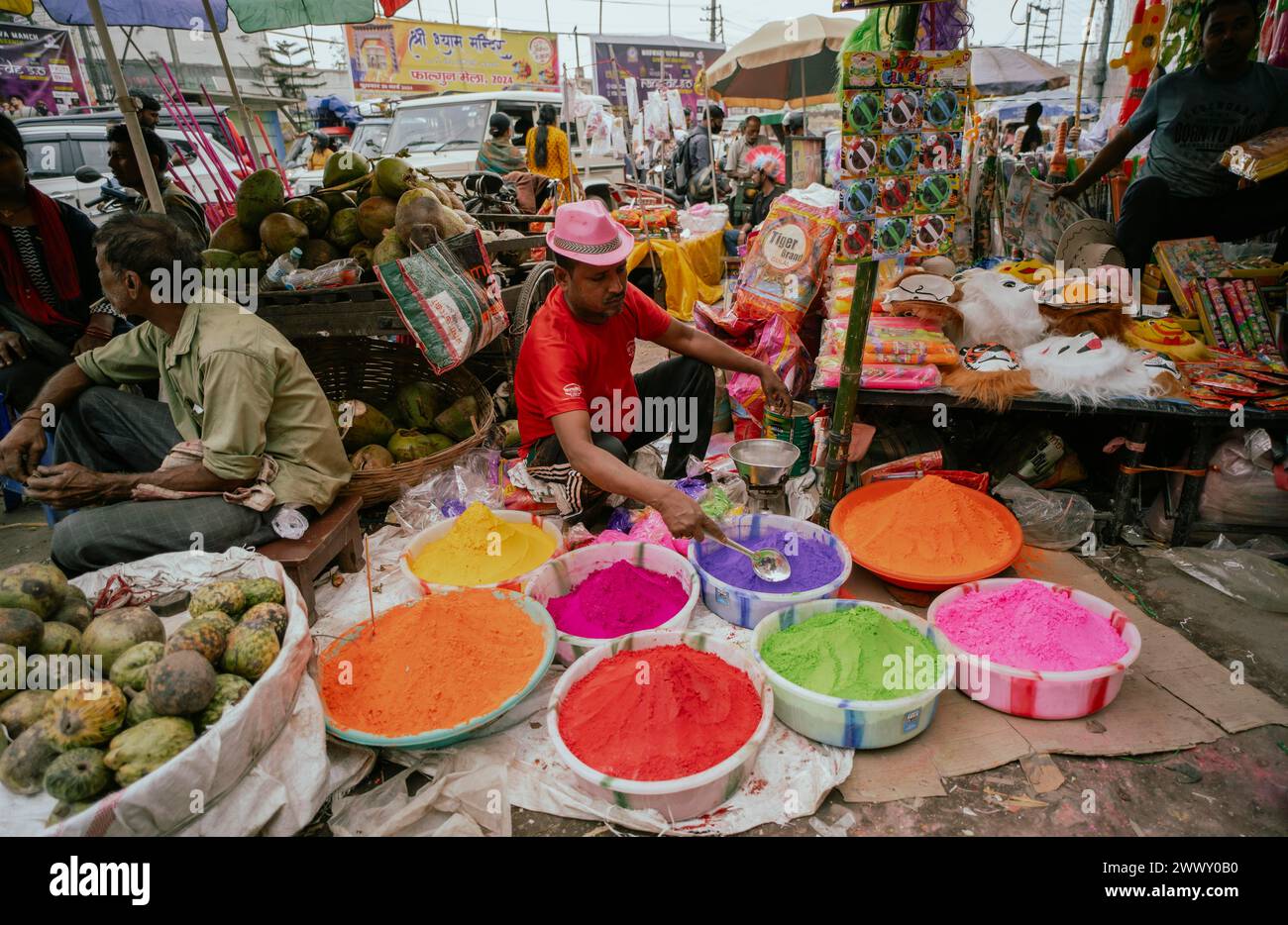 Vendor sells Holi celebration items in a street market, ahead of Holi festival on March 23, 2024 in Guwahati, Assam, India. Holi is the Hindu Stock Photo