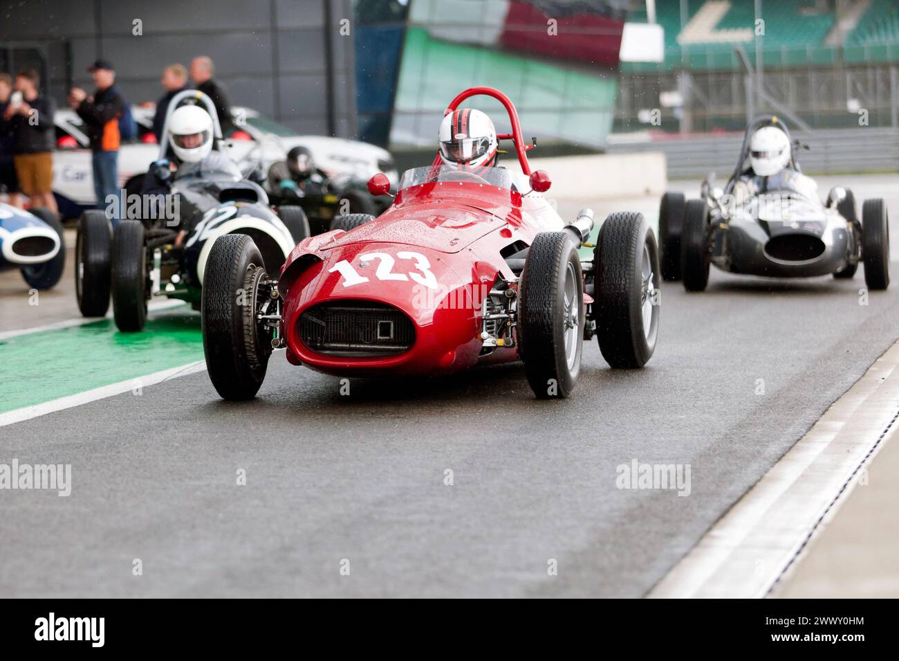 Simon Hope driving his Red, 1954, Maserati 250F, down the International pit lane, before the start of the HGPCA pre '66 Grand prix Cars Race. Stock Photo