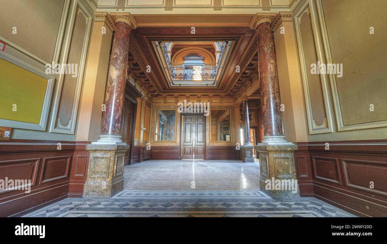 Historic hallway with columns and a geometric floor pattern, atmospherically illuminated, Villa Woodstock, Lost Place, Brill, Wuppertal, North Stock Photo