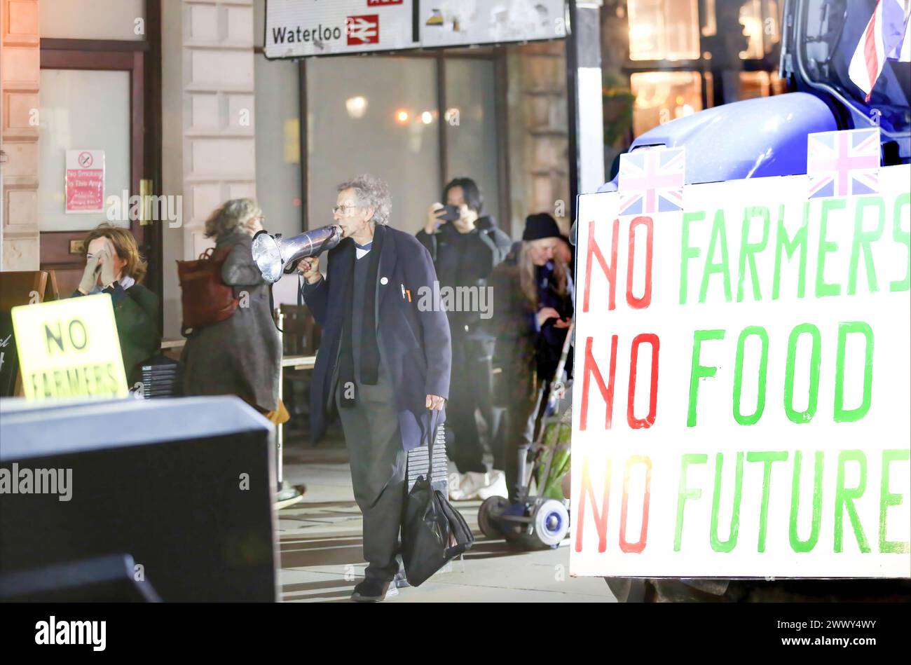 London, UK. 25th Mar, 2024. Piers Corbyn supports the farmers by shouting through a megaphone beside a tractor displaying a No Farmers No Food No Future sign during the demonstration in Parliament Square. Farmers gathered and rode into Parliament Square on more than 130 tractors in a go slow protest demonstrating about the lack of support for British food production. (Photo by Martin Pope/SOPA Images/Sipa USA) Credit: Sipa USA/Alamy Live News Stock Photo