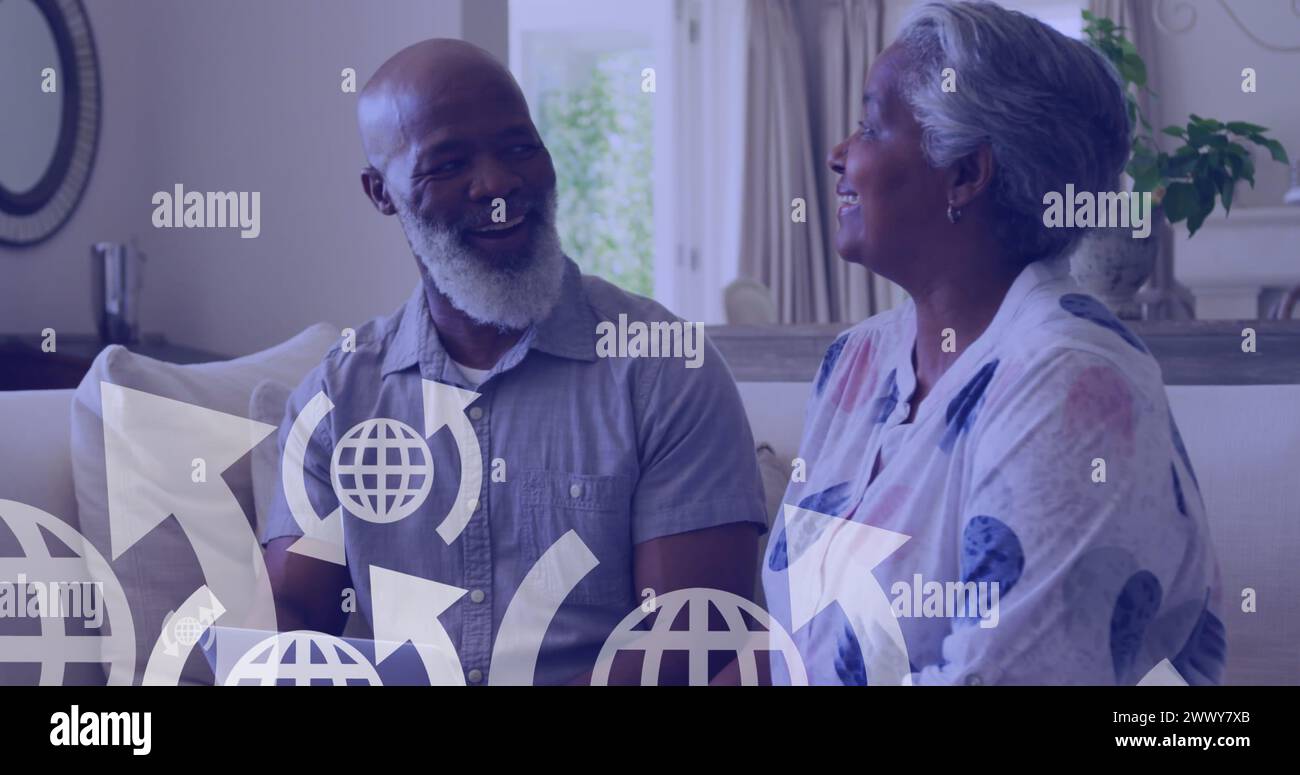 Image of icons over happy senior african american couple sitting on ...