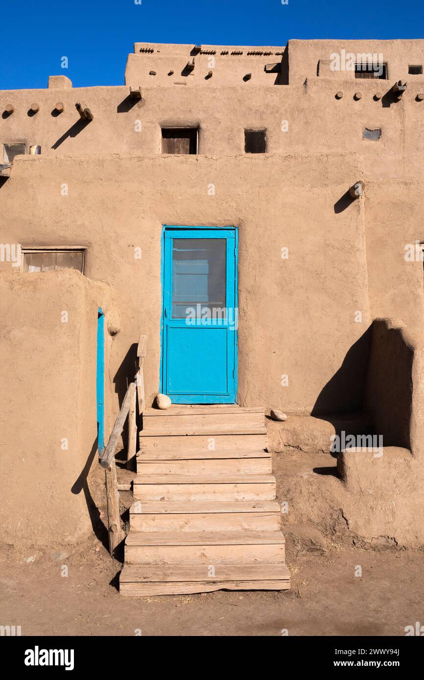 NM00684-00....NEW MEXICO - North House with blue boor, Taos Pueblo tribal land. Stock Photo