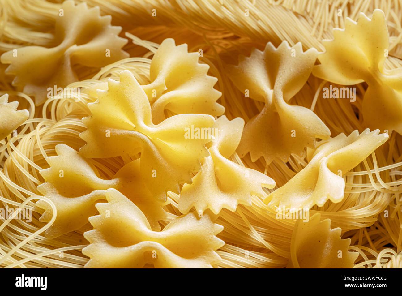 Italian pasta farfalle and vermicelli close-up. Food background. Stock Photo