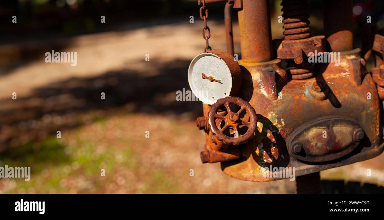 Rusty metal frame of a wine press, emphasizing its industrial setting and agricultural use Stock Photo