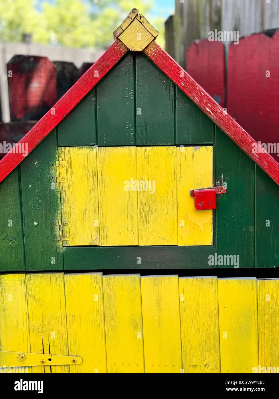 Vibrantly painted house with red, yellow, and green roof Stock Photo