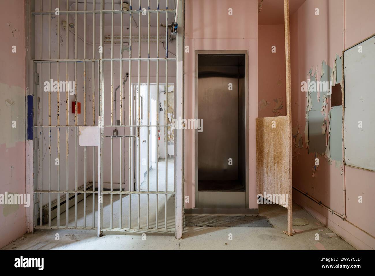 A shower stall inside an abandoned prison. Stock Photo