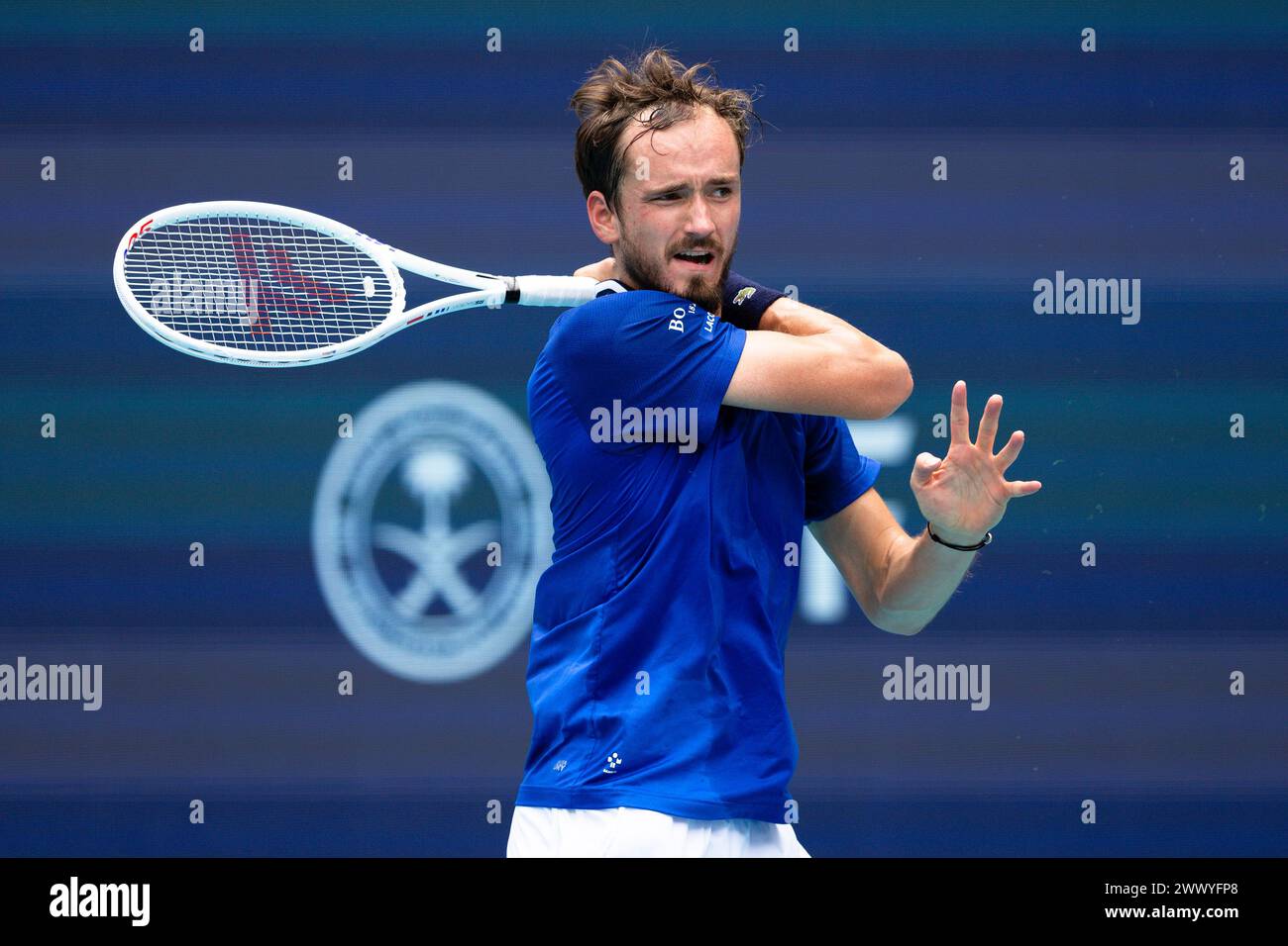 MIAMI GARDENS, FLORIDA - MARCH 26: Daniil Medvedev returns a shot against Dominik Koepfer of Germany during their match on Day 11 of the Miami Open at Hard Rock Stadium on March 26, 2024 in Miami Gardens, Florida. (Photo by Mauricio Paiz) Stock Photo