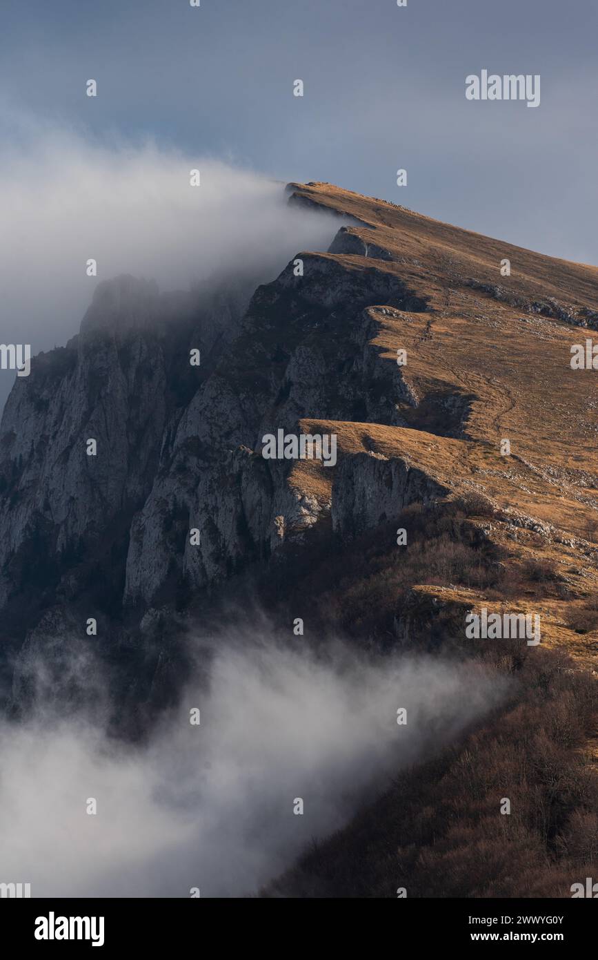 Mountain peak in a cloud and fog. Stock Photo
