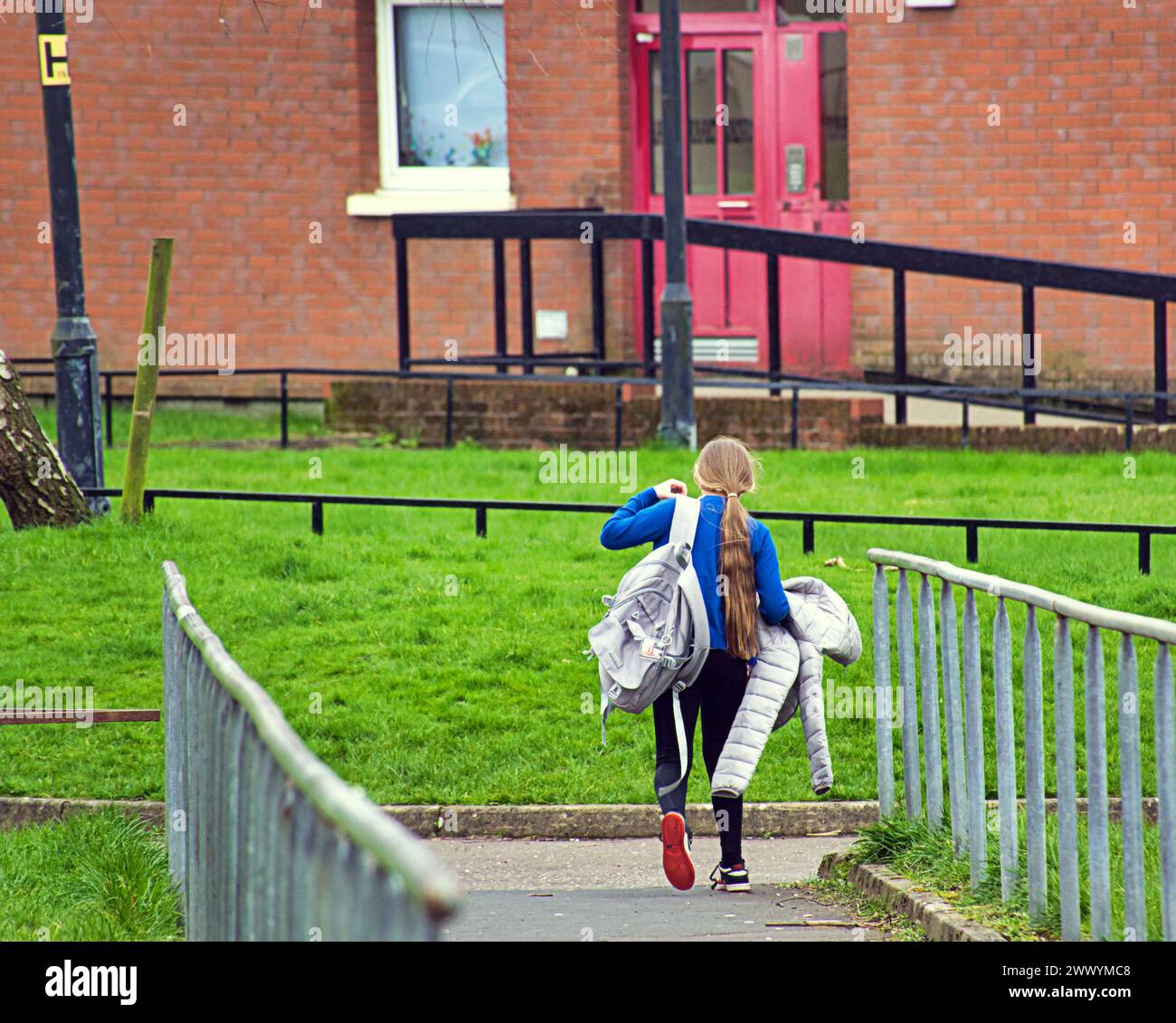 Glasgow, Scotland, UK. 26th March, 2024: UK Weather: kid coming home from school.  Sunny spring weather in the city saw locals and tourists on the streets of the city centre. Poverty in drumchapel. Credit Gerard Ferry/Alamy Live News Stock Photo