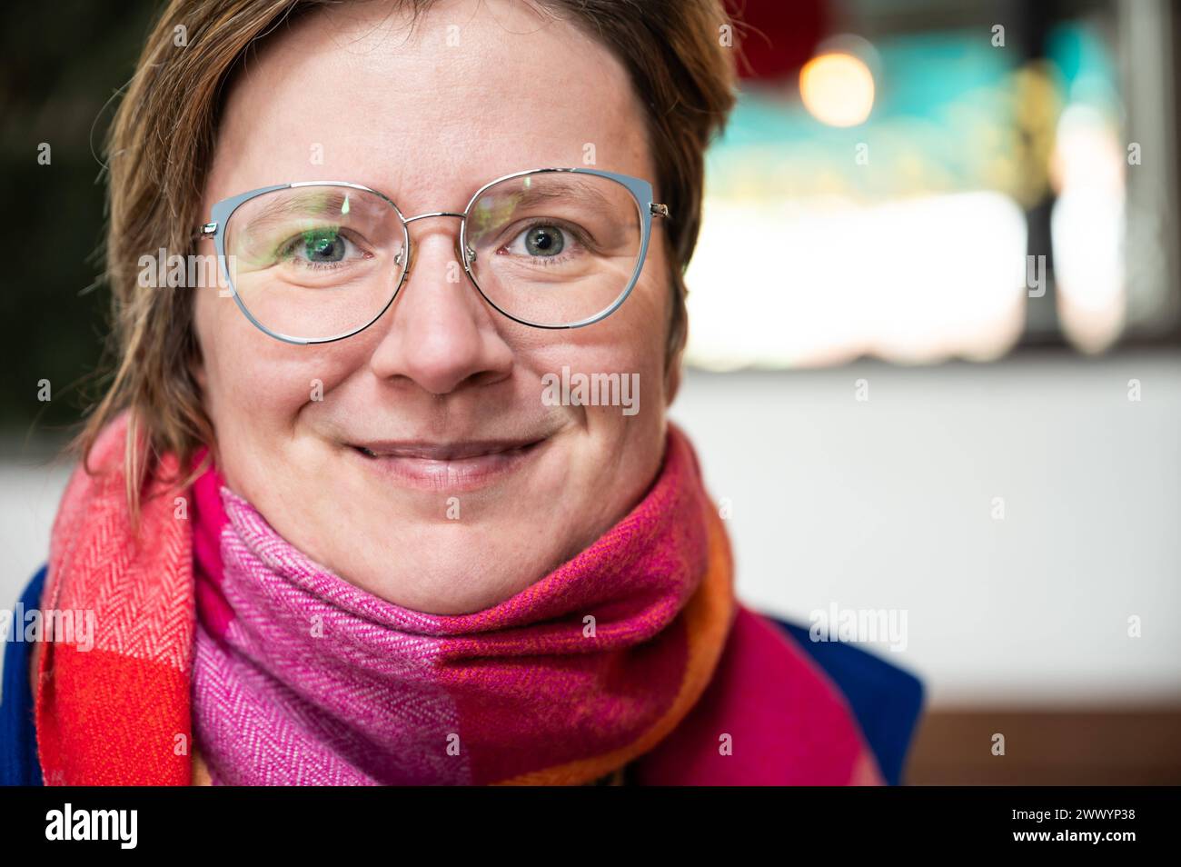 Indoor portrait of a white 38 yo woman, Brussels Old Town, Belgium. Model released Stock Photo